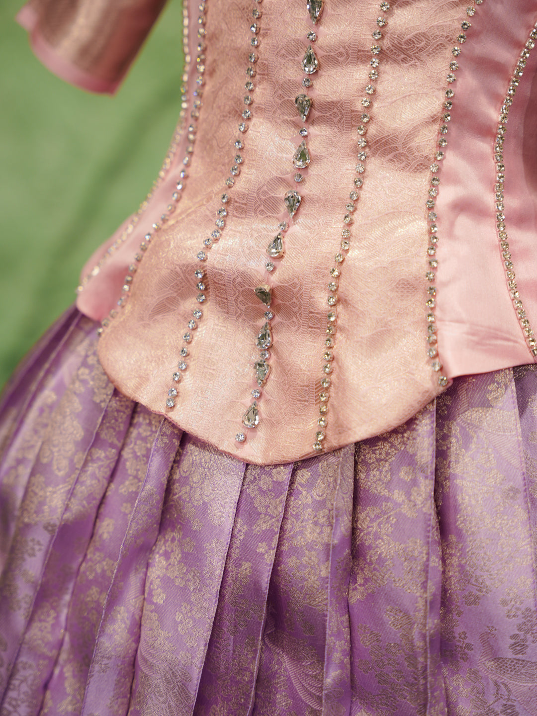 Lavender and pink pattu pavadai in pure Kanchipuram silk with zari border and beaded neckline — waist line view