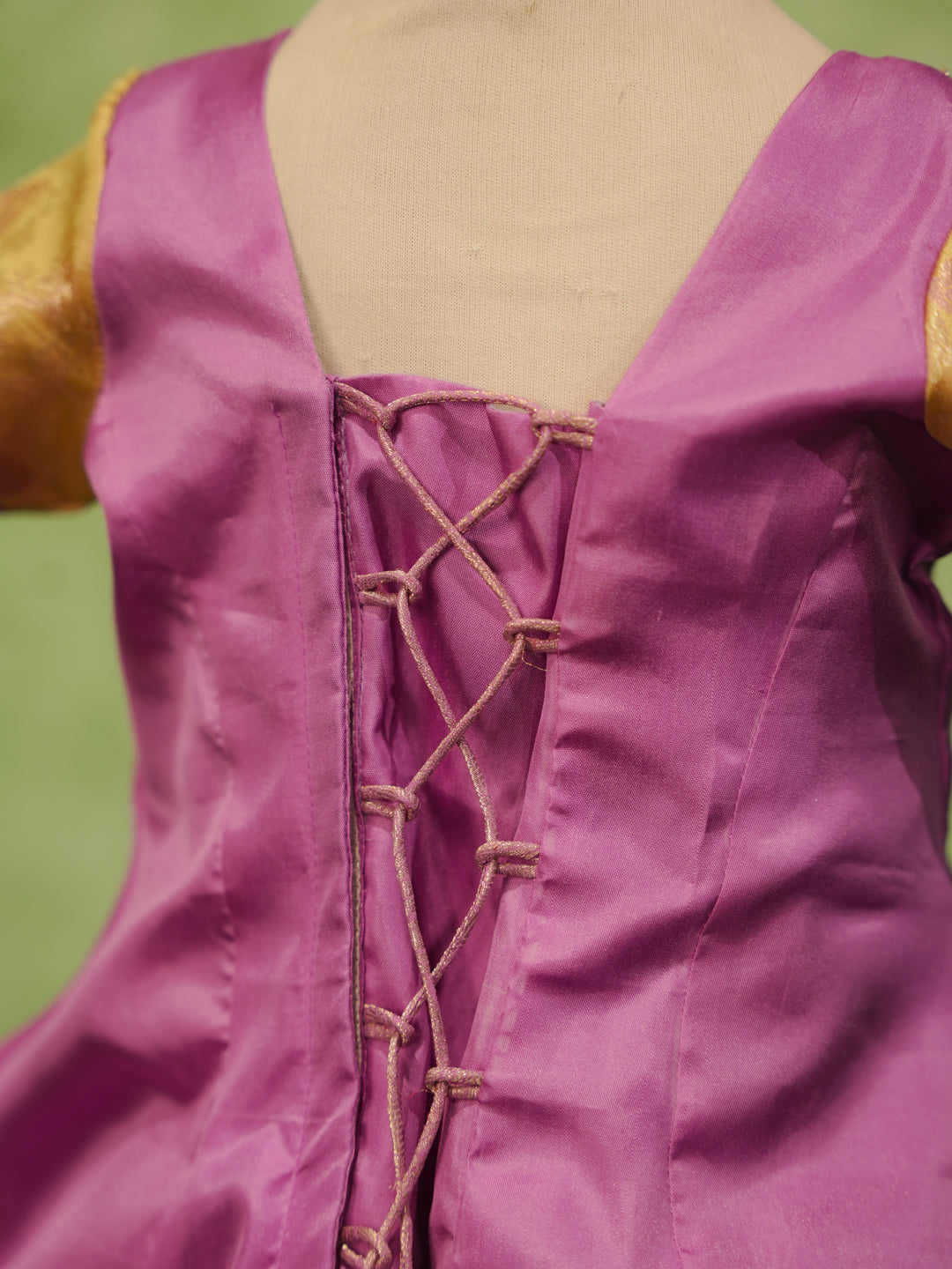 Lavender and gold pattu pavadai in pure Kanchipuram silk with zari skirt and embellished blouse — back view