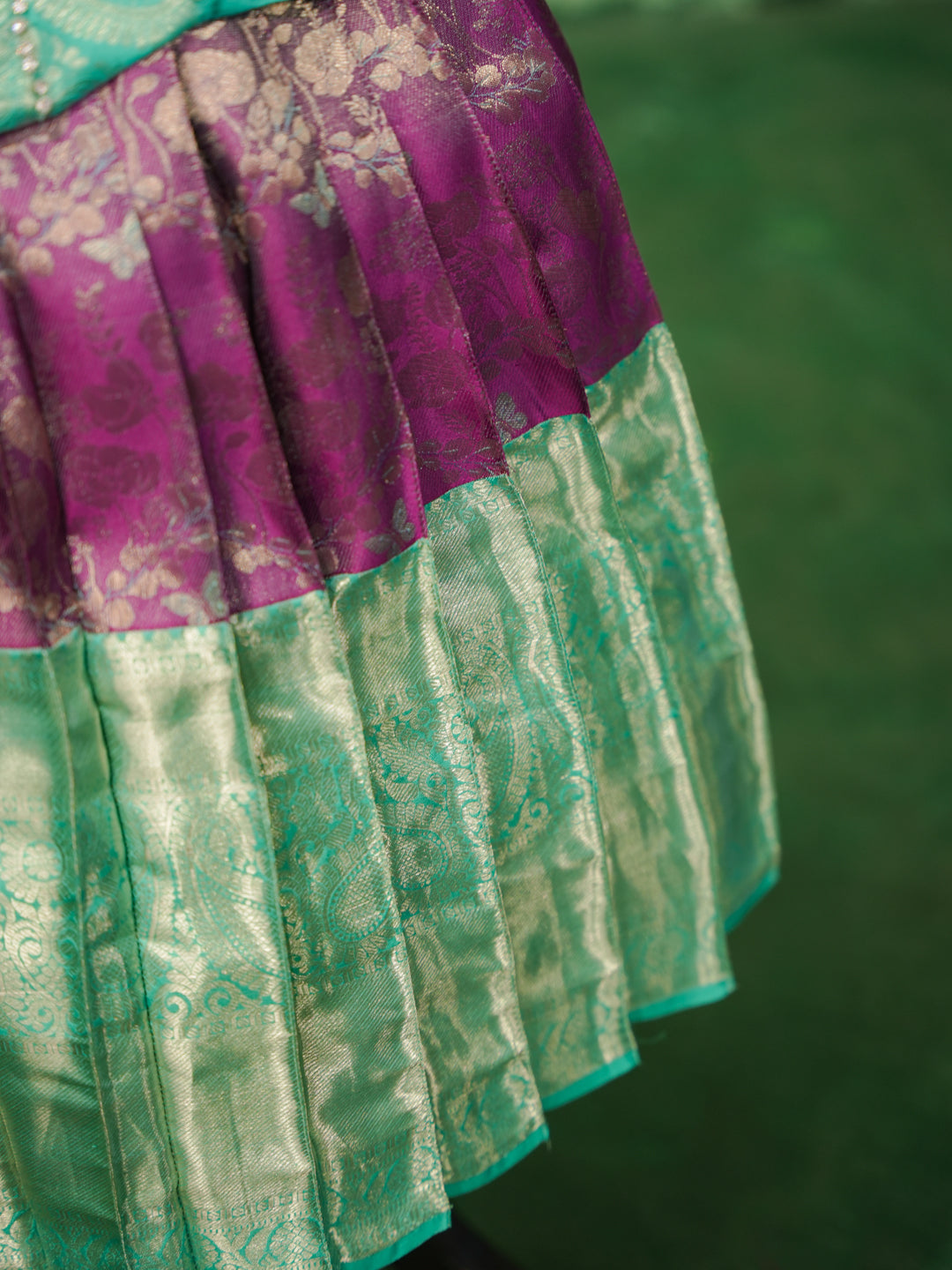 Mint and purple pattu pavadai in pure Kanchipuram silk with embellished blouse and zari skirt — skirt border