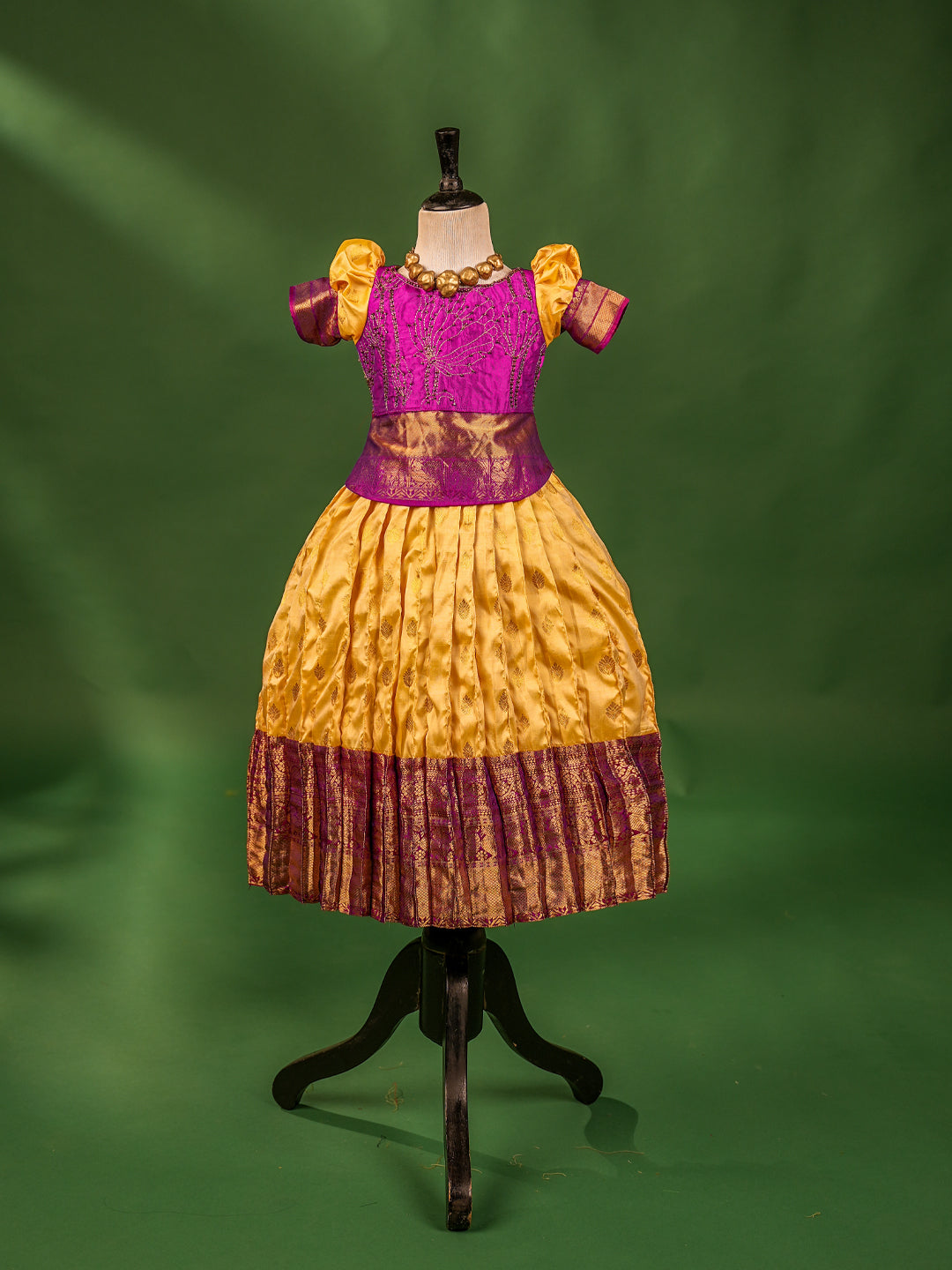Royal Elegance Kanchipuram Silk Pattu Pavadai with Contrast Magenta Blouse & Heart Cut Back