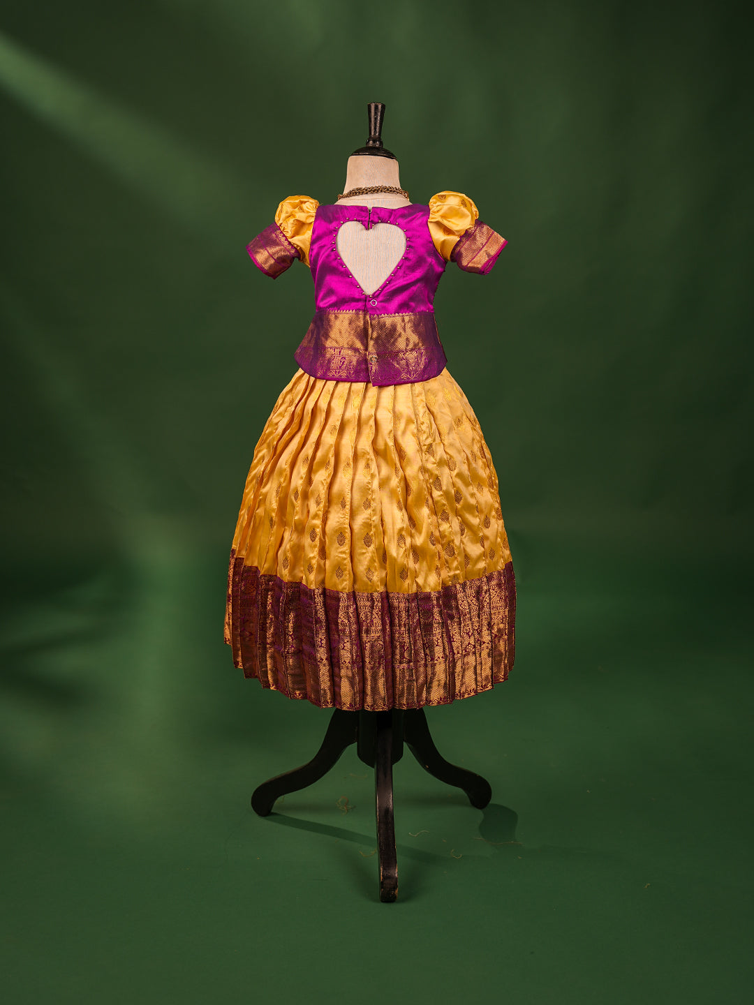 Royal Elegance Kanchipuram Silk Pattu Pavadai with Contrast Magenta Blouse & Heart Cut Back