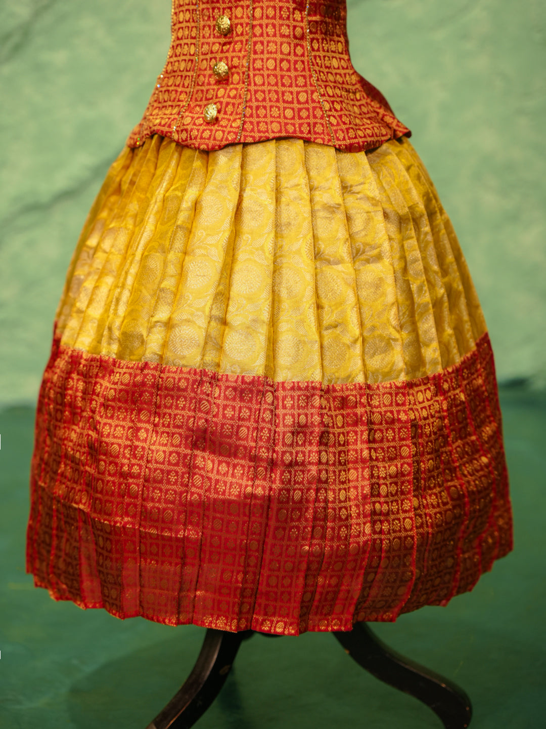Red and yellow pattu pavadai in pure Kanchipuram silk with zari checks and puff sleeves — skirt