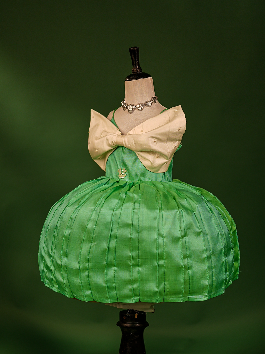 Turquoise Green & Buttermilk White Pure Kanchipuram Silk Gown – Sleeveless with Embroidered Bow