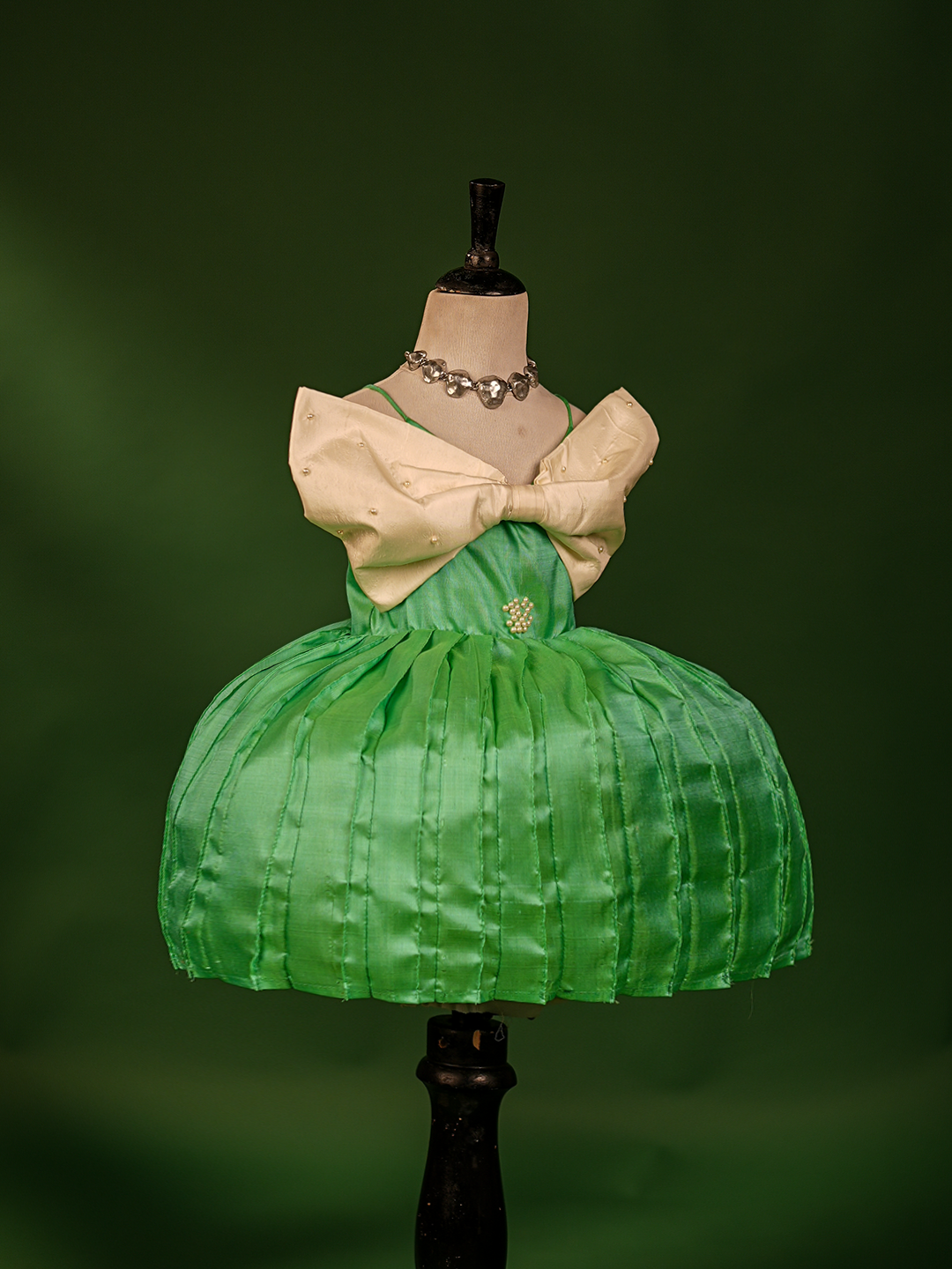 Turquoise Green & Buttermilk White Pure Kanchipuram Silk Gown – Sleeveless with Embroidered Bow