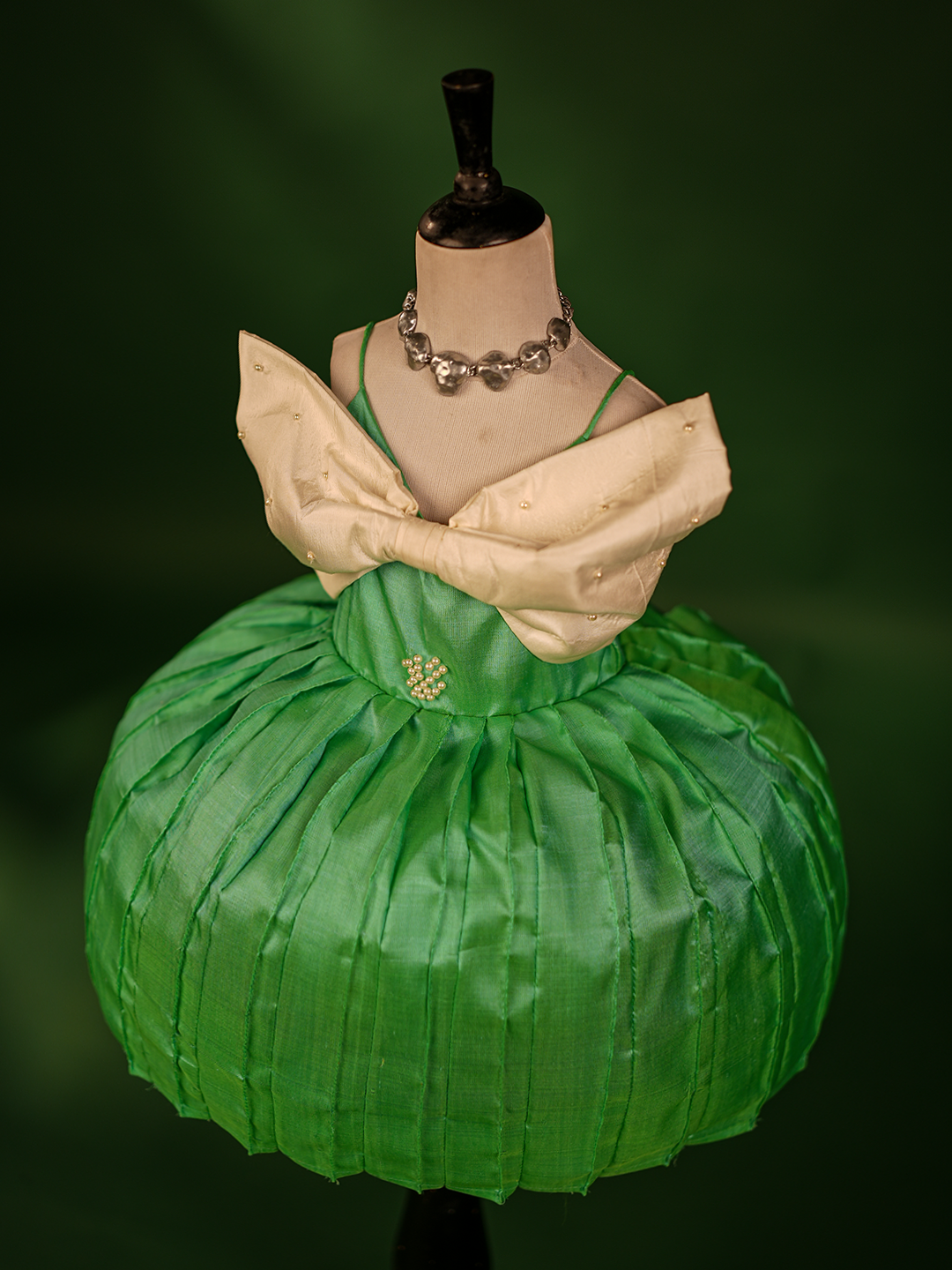 Turquoise Green & Buttermilk White Pure Kanchipuram Silk Gown – Sleeveless with Embroidered Bow