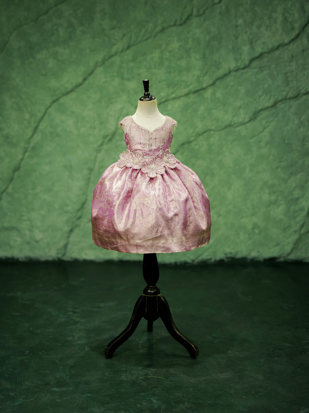 The "Royal Orchid" Kanchipuram silk gown for girls in pink, shown on a mannequin.