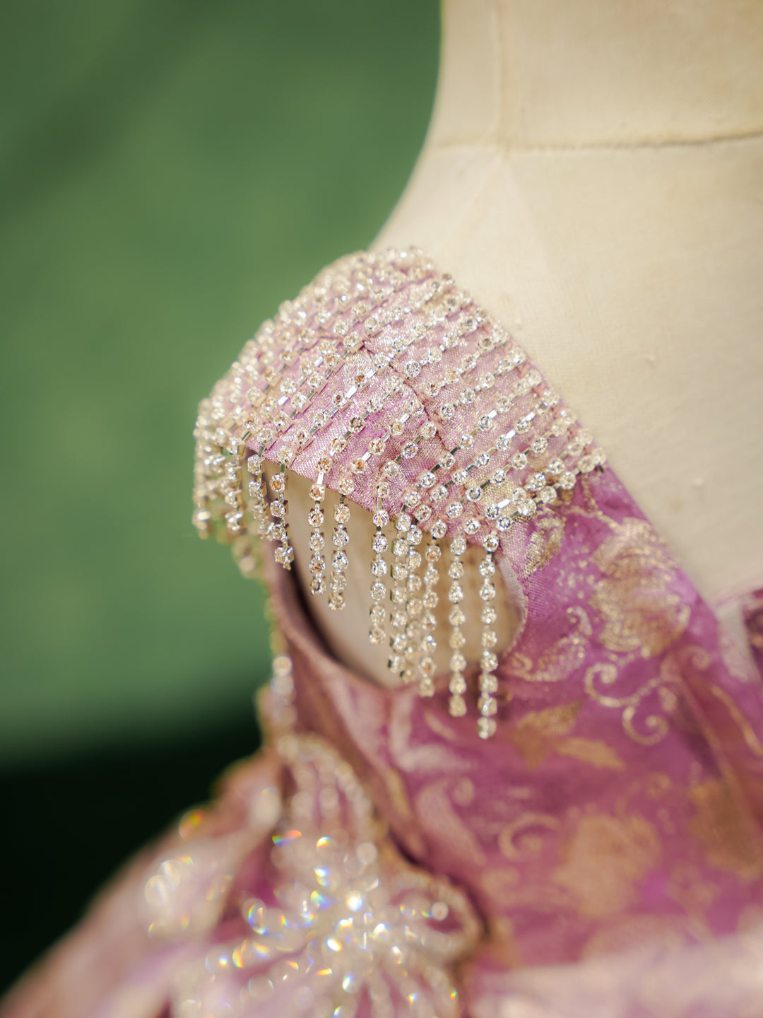 Detail of the draped crystal fringe and beading on the shoulder of a Kanchipuram silk dress.