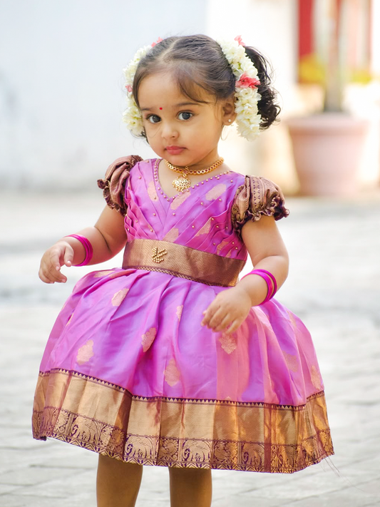 Lavender purple and burgundy silk gown featuring elegant puff sleeves, intricate beaded embroidery, and a rich gold zari border.
