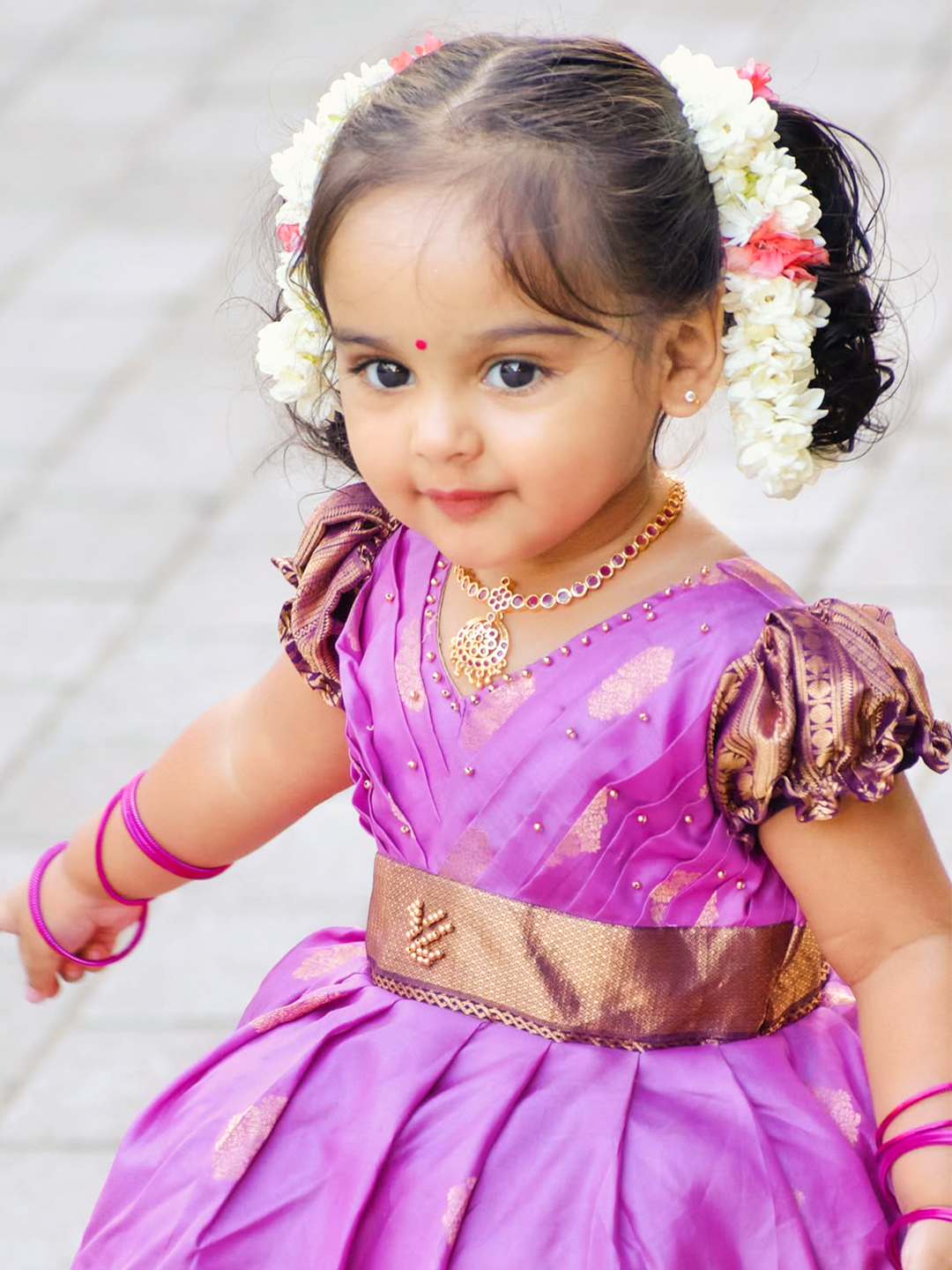 Elegant lavender purple and burgundy silk gown with puff sleeves, delicate beaded embroidery, and a luxurious gold zari border.
