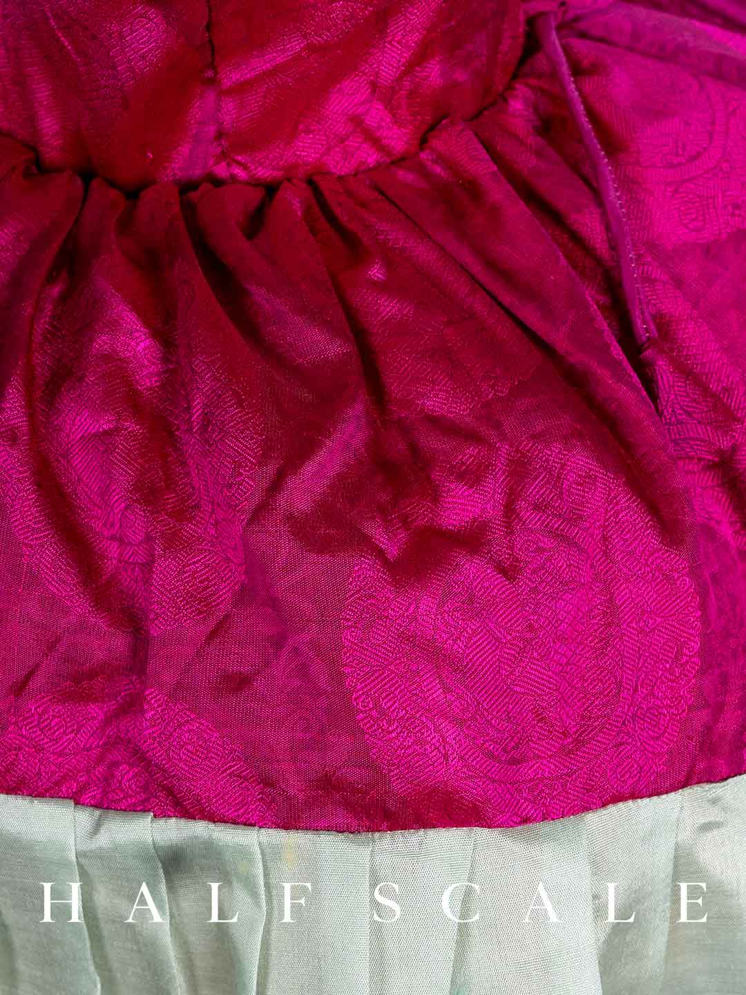 Magenta with Light Green Pleated Kanchipuram Silk Pattu Frocks for Babies and Kids Wedding Dresses.